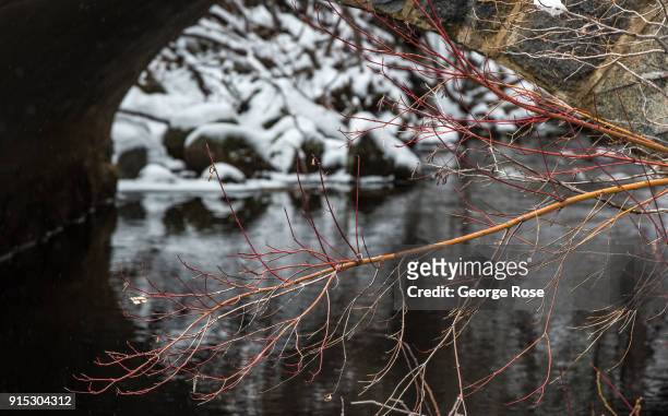 Melting snow flows under Highway 89 at the Eagle Falls trailhead on January 22 in South Lake Tahoe, California. Though a six-year drought in...