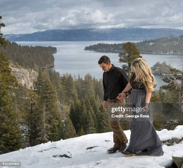 Couple takes their engagement photos at Eagle Falls, located above scenic Emeral Bay, on January 22 in South Lake Tahoe, California. Though a...