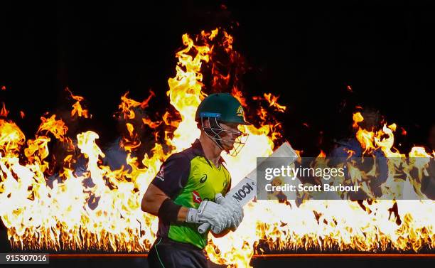 Arcy Short of Australia walks out to bat through flames during the Twenty20 International match between Australia and England at Blundstone Arena on...