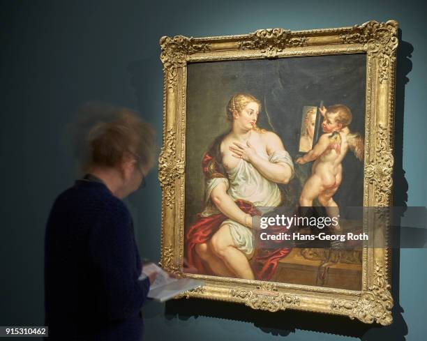Visitor stands in front of Venus and Cupido, Peter Paul Rubens, during the 'Rubens - Kraft der Verwandlung' exhibition preview at Staedel Museum on...