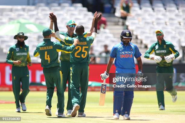 Kagiso Rabada of South Africa is congratulated Chris Morris of South Africa for getting Rohit Sharma of India's wicket during the 3rd Momentum ODI...