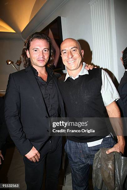 Manuele Malenotti and actor Roberto Ciufoli attend the Audi A3 Cabriolet Style by Belstaff party presented by Belstaff at the Belstaff store on...