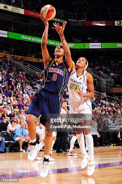 Tammy Sutton-Brown of the Indiana Fever shoots a layup against Tangela Smith of the Phoenix Mercury in Game Two of the WNBA Finals during the 2009...
