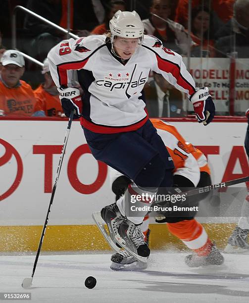 Nicklas Backstrom of the Washington Capitals sidesteps a check by Mike Richards of the Phildelphia Flyers at the Wachovia Center on October 6, 2009...