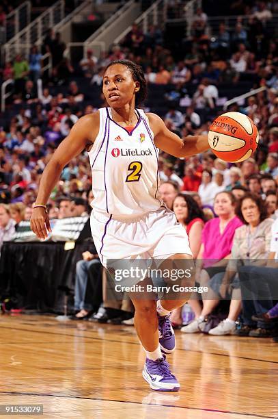 Temeka Johnson of the Phoenix Mercury moves the ball upcourt against the Indiana Fever in Game Two of the WNBA Finals during the 2009 NBA Playoffs at...