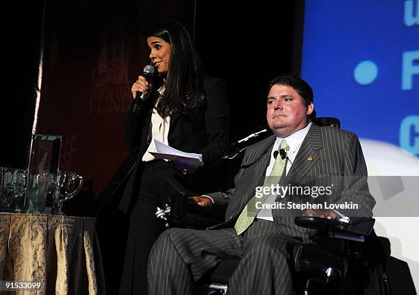 Stephanie Sayfie Aagaard and President of The Miami Project and The Buoniconti Fund to Cure Paralysis Marc Buoniconti speak onstage during The 24th...