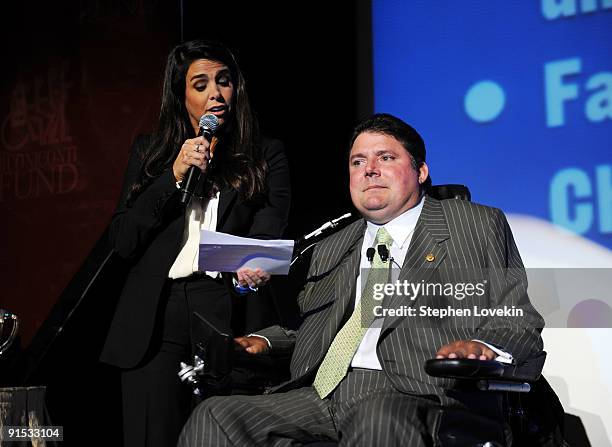 Stephanie Sayfie Aagaard and President of The Miami Project and The Buoniconti Fund to Cure Paralysis Marc Buoniconti speak onstage during The 24th...