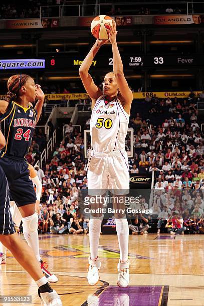 Tangela Smith of the Phoenix Mercury shoots a jump shot against Tamika Catchings of the Indiana Fever in Game Two of the WNBA Finals during the 2009...