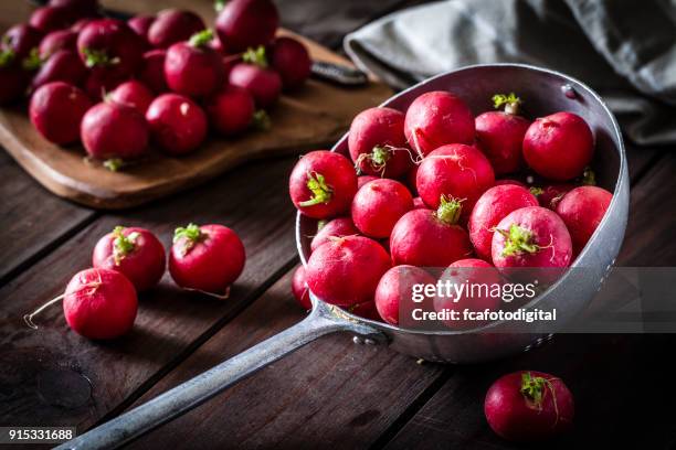 red radish in an old metal colander - radish stock pictures, royalty-free photos & images