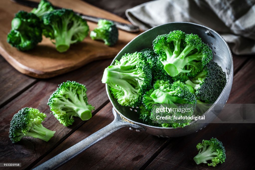 Broccoli in an old metal colander