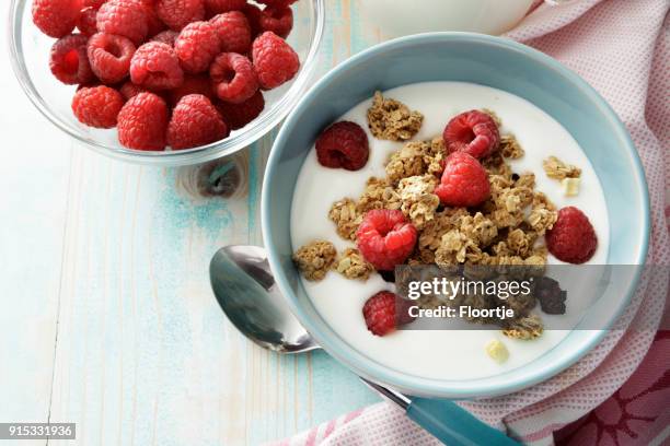 breakfast: granola with raspberries still life - yogurt stock pictures, royalty-free photos & images