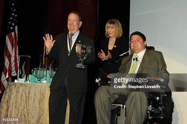 Honoree Jack Schneider, Carol Rahr and President of The Miami Project and The Buoniconti Fund to Cure Paralysis Marc Buoniconti speak onstage during...