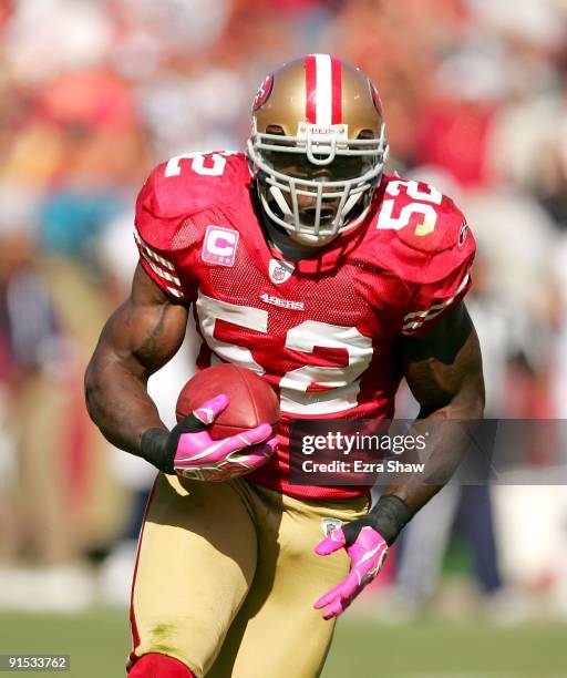 Patrick Willis of the San Francisco 49ers returns a interception for a touchdown during their game against the St. Louis Rams at Candlestick Park on...