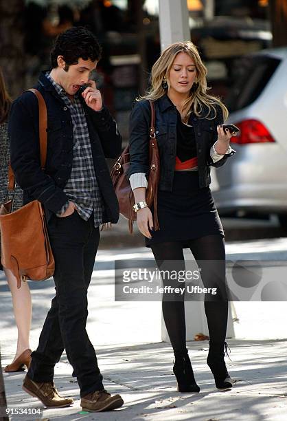 Actors Penn Badgley and Hilary Duff is seen on location for "Gossip Girl" on the streets of Manhattan on October 6, 2009 in New York City.