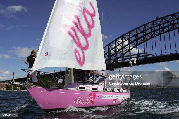 Year old solo sailor Jessica Watson sails her yacht Ella's Pink Lady beneath Sydney Harbour Bridge during the official launch of her solo round the...