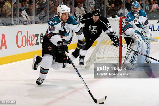 Kent Huskins of the San Jose Sharks carries the puck against the Los Angeles Kings on October 6, 2009 at Staples Center in Los Angeles, California.