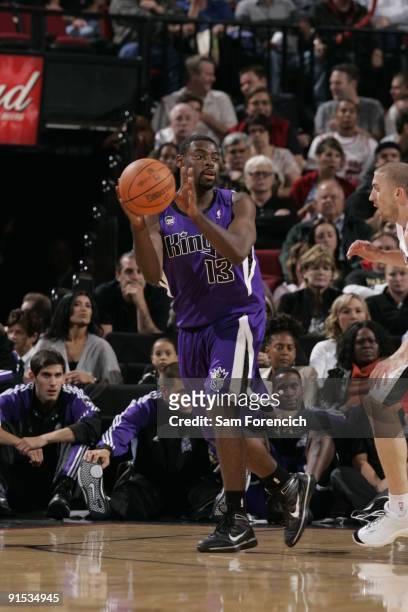 Tyreke Evans of the Sacramento Kings looks to pass around Steve Blake of the Portland Trail Blazers during a game on October 6, 2009 at the Rose...
