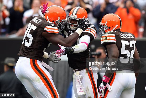 Kamerion Wimbley, Mike Adams and D'Qwell Jackson of the Cleveland Browns ocelebrate a play against the Cincinnati Bengals during their game at...