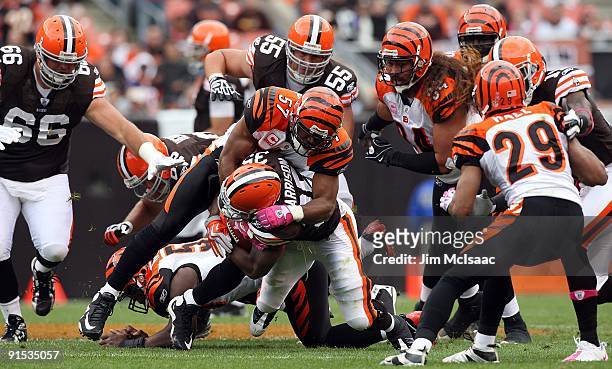 Dhani Jones of the Cincinnati Bengals makes a tackle against the Cleveland Browns during their game at Cleveland Browns Stadium on October 4, 2009 in...