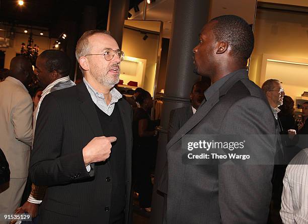 Creative Director Jim Moore and Mathias Kiwanuka of the New York Giants attend the GQ & Hugo Boss Fall Collection Event on October 6, 2009 in New...