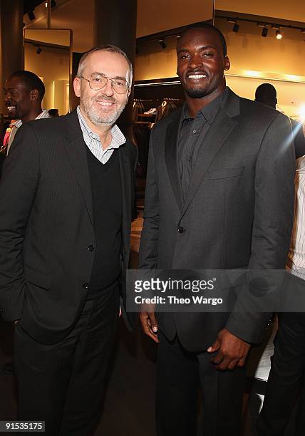 Creative Director Jim Moore and Mathias Kiwanuka of the New York Giants attend the GQ & Hugo Boss Fall Collection Event on October 6, 2009 in New...