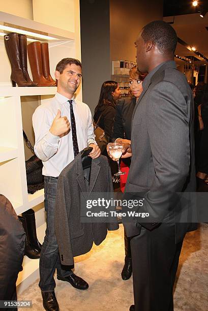 Style Correspondent Brett Fahlgren and Mathias Kiwanuka of the New York Giants attend the GQ & Hugo Boss Fall Collection Event on October 6, 2009 in...