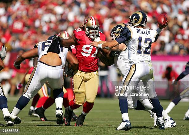 Ray McDonald of the San Francisco 49ers tries to get to Kyle Boller of the St. Louis Rams at Candlestick Park on October 4, 2009 in San Francisco,...