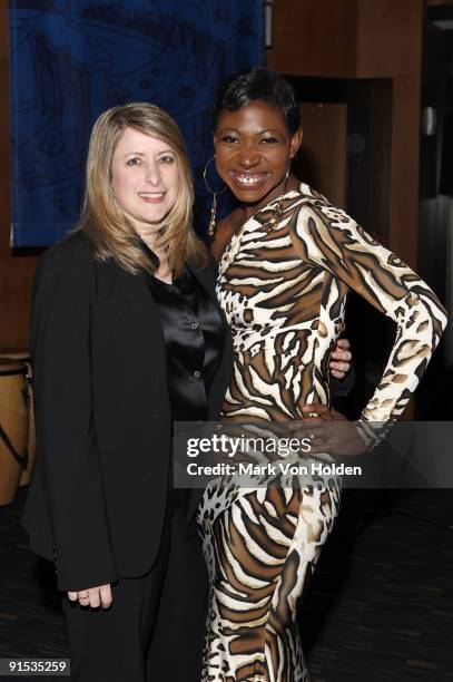 President of the Church of Scientology New York, Lori Alpers and celebrity activist Suzanne "Africa" Engo dressed in Marc Bouwer collection and...