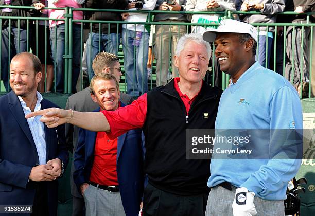 Former President Bill Clinton & Vijay Singh chat on the range during practice for The Presidents Cup at Harding Park Golf Club on October 6, 2009 in...