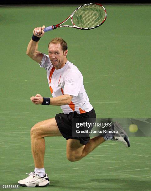 Rainer Schuettler of Germany plays a forehand in his match against Andreas Beck of Germany during day three of the Rakuten Open Tennis tournament at...