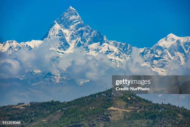 The Machapuchare mountain in Nepal, in the Annapurna Himalayas region in Nepal. It's nickname is Matternhorn of Nepal. The name Machapuchare in...