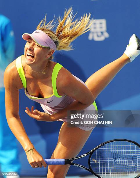 Maria Sharapova of Russia returns a shot against Victoria Azarenka of Belarus during the second round match at the China Open 2009 in Beijing on...