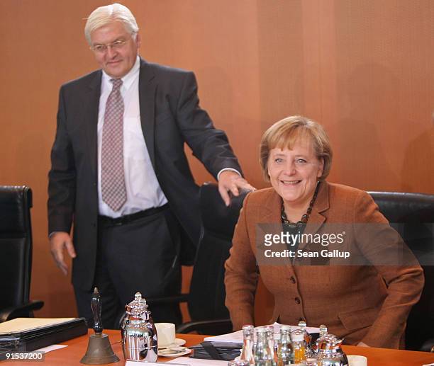 German Chancellor Angela Merkel and outgoing Vice Chancellor and Foreign Minister Frank-Walter Steinmeier arrive for the final German weekly cabinet...