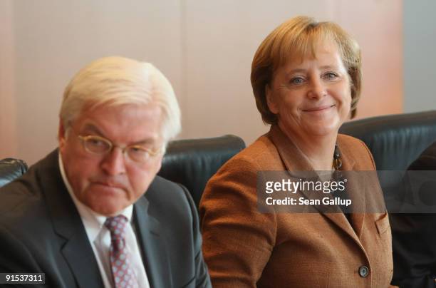 German Chancellor Angela Merkel and outgoing Vice Chancellor and Foreign Minister Frank-Walter Steinmeier arrive for the final German weekly cabinet...