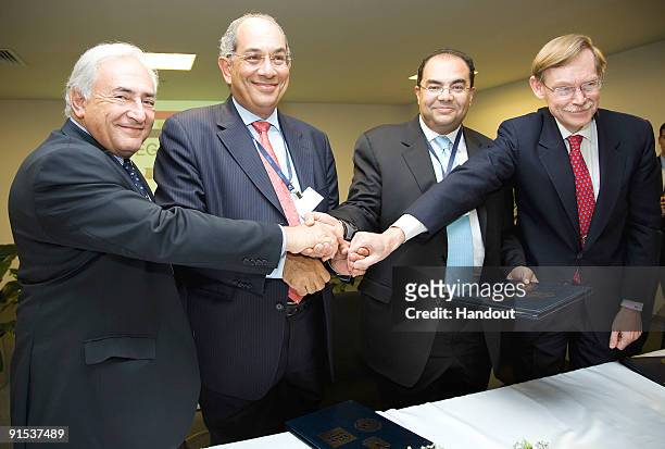 In this handout image supplied by the IMF, International Monetary Fund's Managing Director Dominique Strauss-Kahn , Egyptian Finance Minister and...