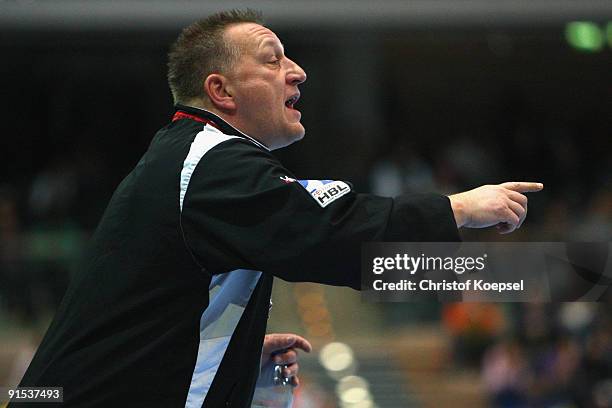 Head coach Michael Biegler of Magdeburg issues instructions to the team during the Toyota Handball Bundesliga match between HSG Duesseldorf and SC...