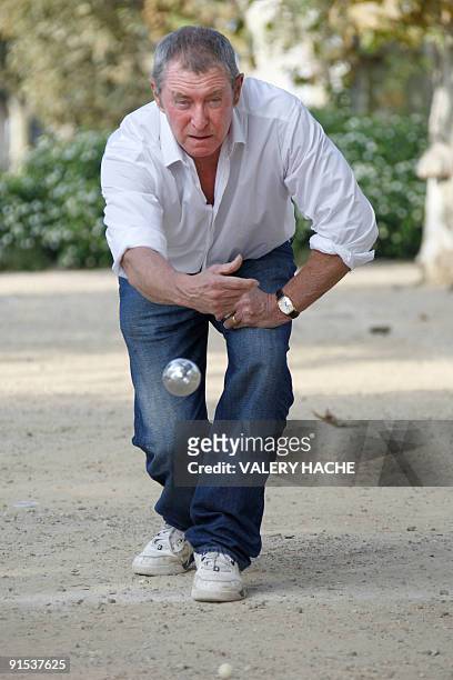 British actor John Nettles plays Petanque during a photocall for the "Midsomer Murders" TV show at the 25th edition of the MIPCOM on October 6, 2009...