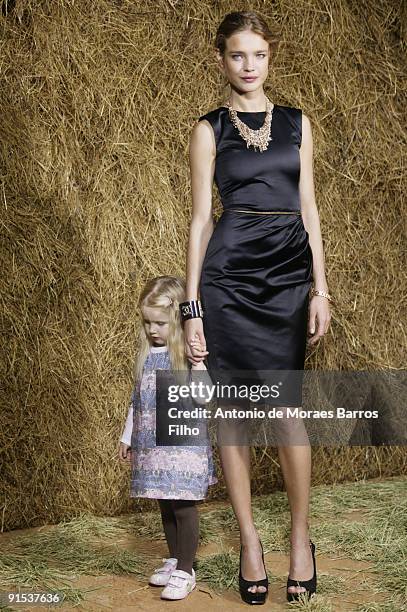 Natalia Vodianova and daughter attend the Chanel Pret a Porter show as part of the Paris Womenswear Fashion Week Spring/Summer 2010 at Grand Palais...