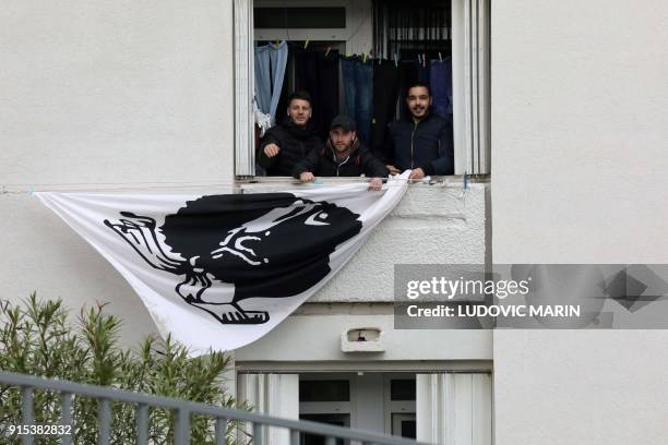Residents display a Corsican flag in the window of a building near the Alb'Oru cultural centre, where the French President delivers a speech in...