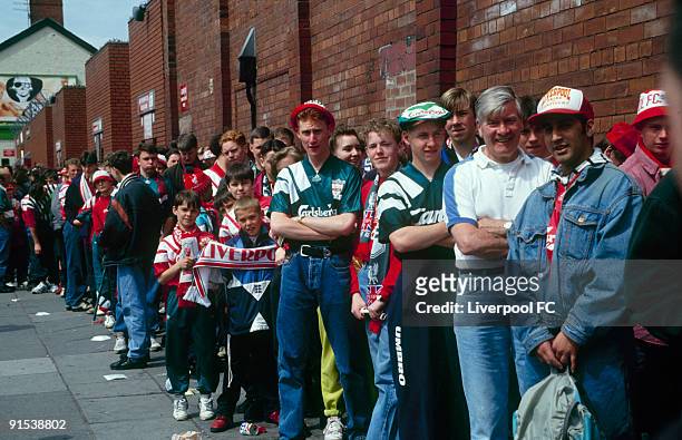 Liverpool FC fans line up to gain entry onto the Spion Kop stand, Anfield for the very last time to watch a football match during the FA Carling...