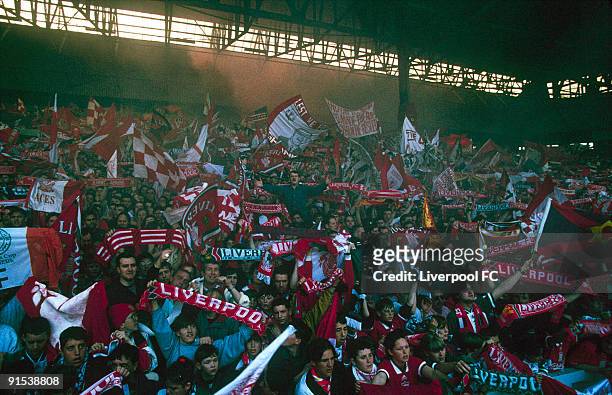Fans in the Spion Kop at Anfield are a mass of colour and noise as they celebrate the last day of the old, standing Kop during the FA Carling...