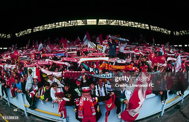 Fans in the Spion Kop at Anfield are a mass of colour and noise as they celebrate the last day of the old, standing Kop during the FA Carling...