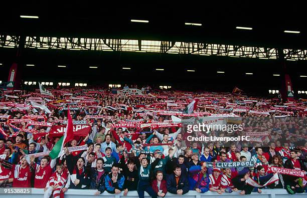 Fans in the Spion Kop at Anfield are a mass of colour and noise as they celebrate the last day of the old, standing Kop during the FA Carling...