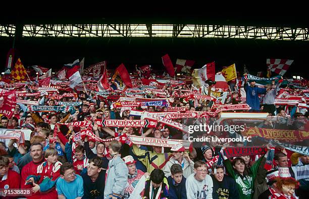 Fans in the Spion Kop at Anfield are a mass of colour and noise as they celebrate the last day of the old, standing Kop during the FA Carling...