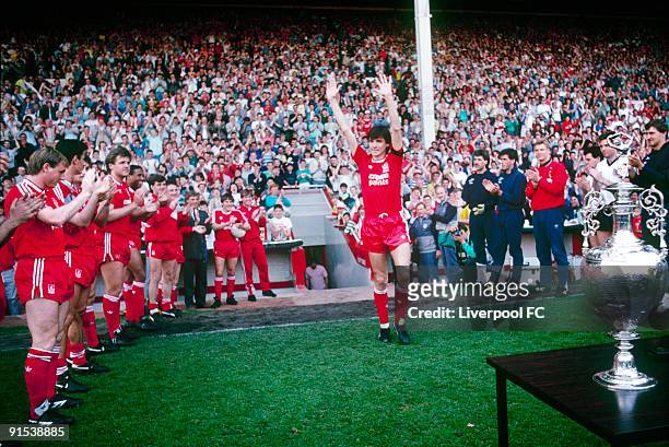 Alan Hansen, captain of Liverpool acknowledges the appreciation of the Anfield crowd and his team-mates as he steps out for his testimonial game in...