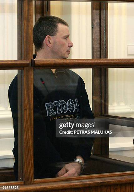 Michael Campbell, an Irishman suspected of attempting to buy arms in Lithuania for an Irish Republican Army splinter group, stands in the dock during...