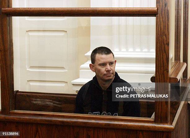 Michael Campbell, an Irishman suspected of attempting to buy arms in Lithuania for an Irish Republican Army splinter group, sits in the dock during...