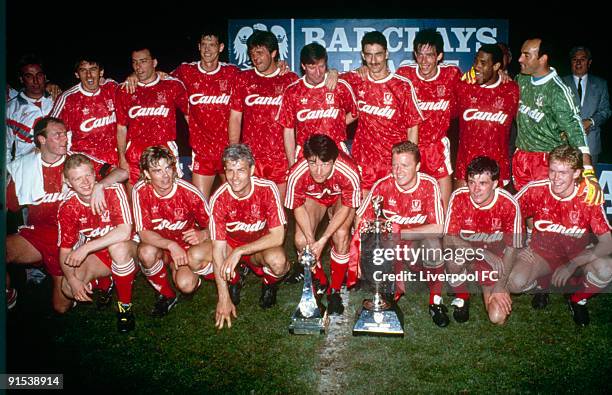 Liverpool FC players line up to pose with the league title after being crowned 1989/90 league champions after the Barclays League Division One match...