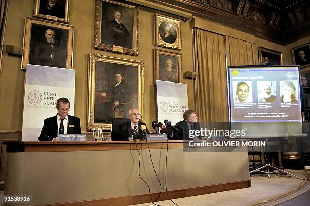 Photos of Venkatraman Ramakrishnan and Thomas Steitz of the US and Israel's Ada Yonath are displayed on a screen as they win the Nobel Chemistry...