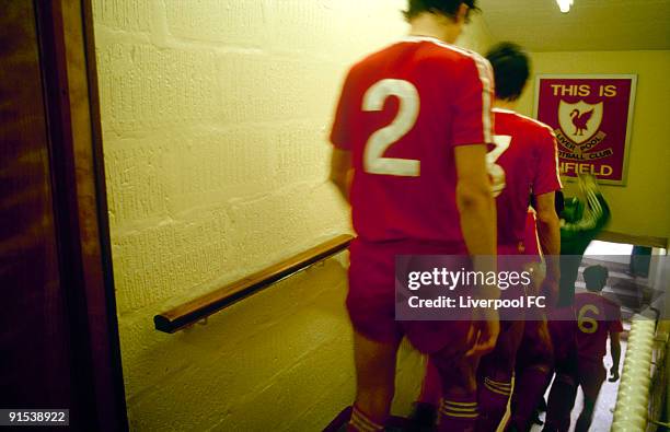 Liverpool goalkeeper Bruce Grobbelaar touches the famous "This is Anfield" sign as the players descend down the steps in the players tunnel to enter...